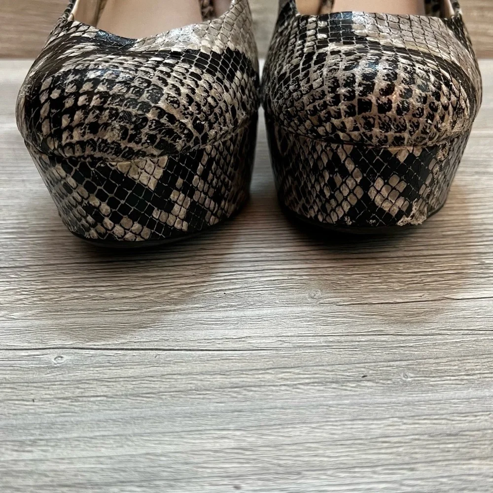 Olsenboye tall platform snakeskin patterned high heels. Closed toe size 9